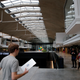 A man enters the world's biggest start-up incubator Station F, in Paris, Wednesday, Jan. 31, 2018. For a glimpse at President Emmanuel Macron's vision for the new French economy, look no farther than Station F. Entrepreneurs don virtual reality goggles and share ideas with business angels in this old Paris train station-turned-startup incubator. (AP Photo/Christophe Ena)